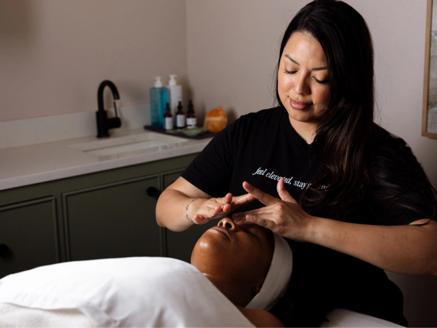 Person receiving a facial treatment in a professional setting.