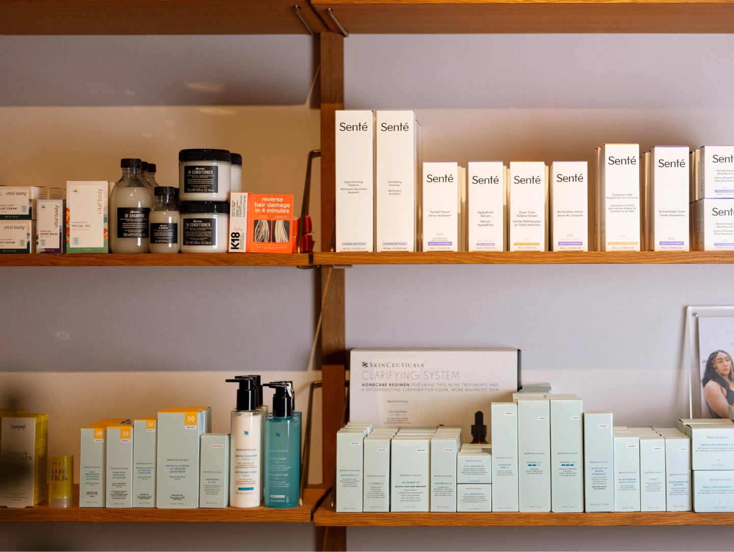 Shelves with various skincare products and boxes on a neutral background