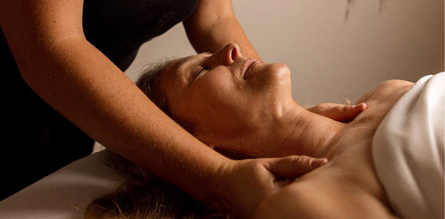 Person receiving a massage with a neutral background